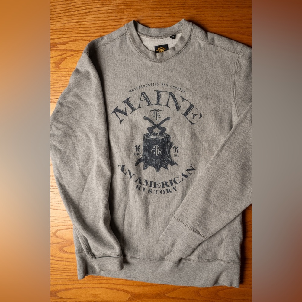 Grey crewneck sweatshirt.